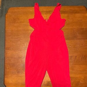 Red jumpsuit with side slits